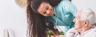 nurse with a patient smiling