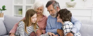 Grandparents happily spending time with grandchildren