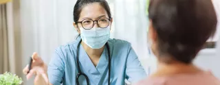 Health care professional talking with Patient