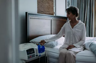 female patient at bedside with Claria