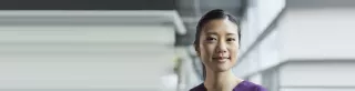 asian woman looks at us