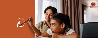 Image of a young girl holding a paintbrush while her mother looks on