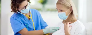 Nurse examining patient header